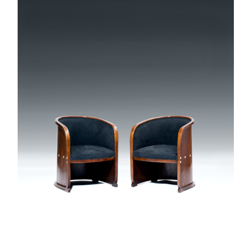 TWO ARMCHAIRS so-called BARREL CHAIRS